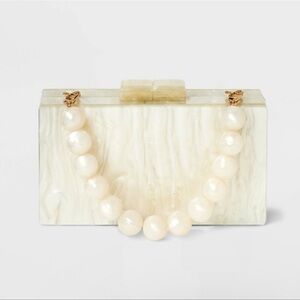 NWT pearlized minaudiere clutch in cream- A New Day
